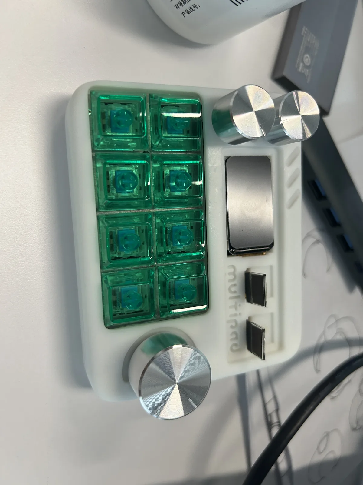 MultiPad front with transparent mechanical keys, rotary controls, and display openings